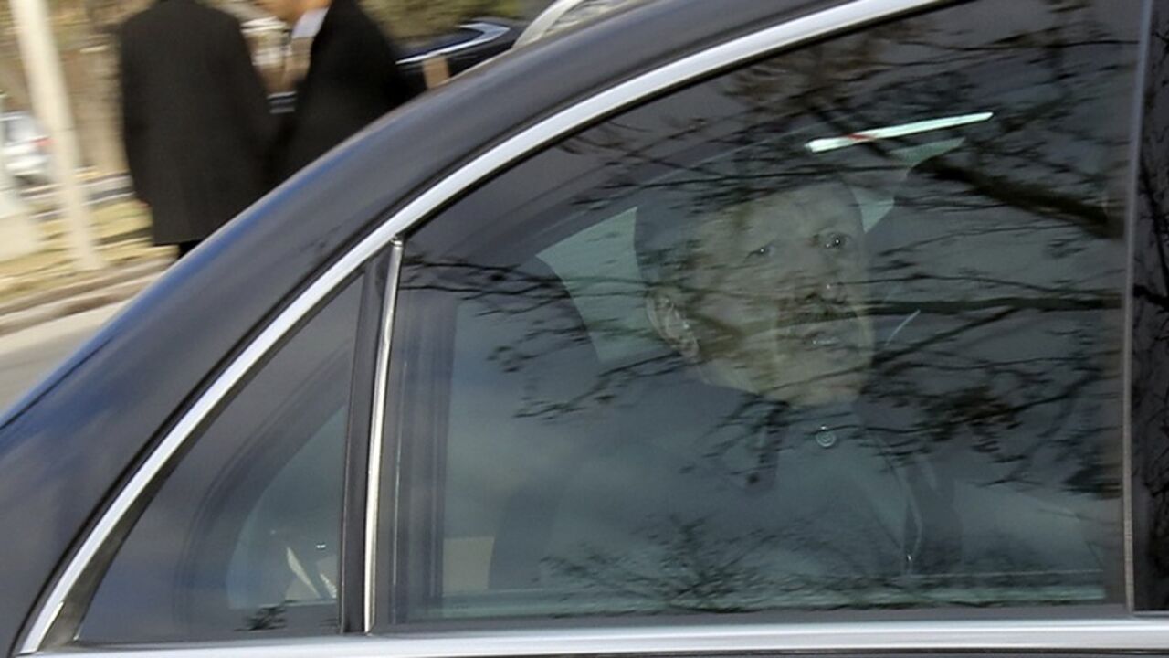 TURKEY-ERDOGAN/ Turkey's Prime Minister Tayyip Erdogan arrives for the National Security Council meeting in his car at the Presidential Palace in Ankara February 26, 2014. Erdogan accused his enemies on Tuesday of hacking encrypted state communications to fake a phone conversation suggesting he warned his son to hide large sums of money before police raids as part of the inquiry. REUTERS/Stringer (TURKEY - Tags: POLITICS CIVIL UNREST) - RTR3FQKO