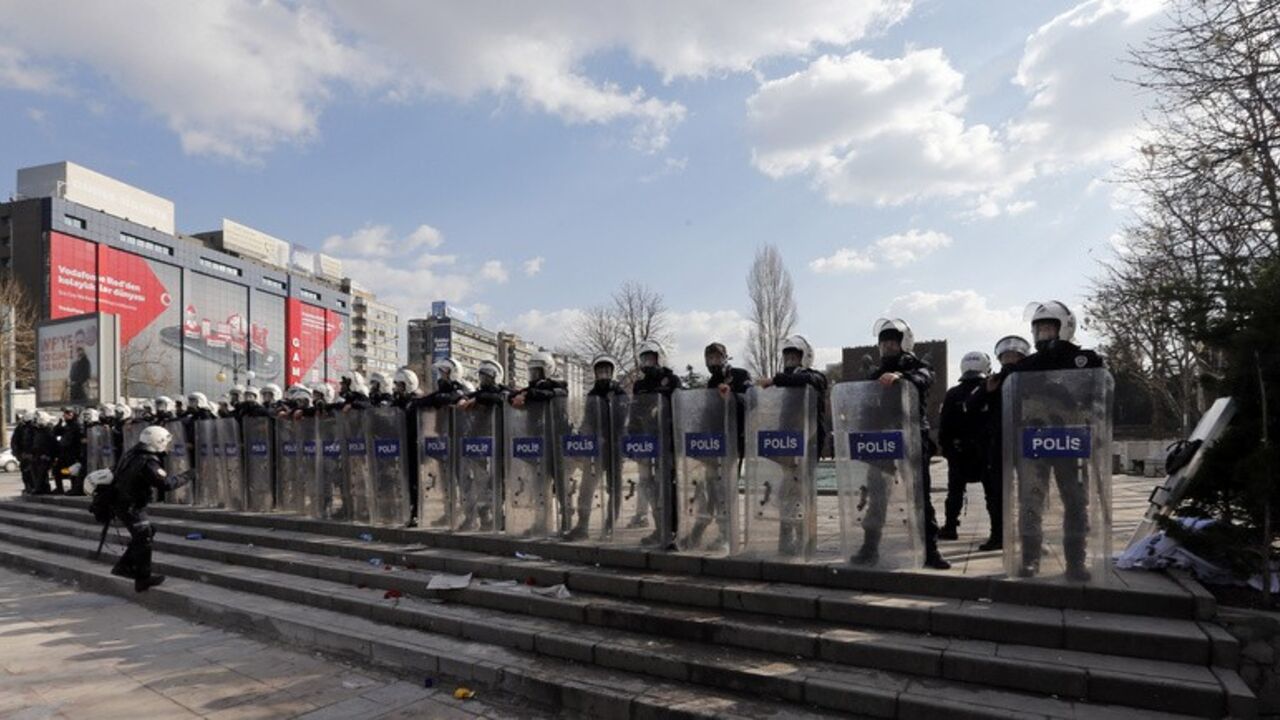 Riot police stand in line as they prepare to disperse demonstrators in Ankara Riot police stand in line as they prepare to disperse demonstrators in Ankara March 12, 2014. Turkish police fired tear gas and water cannon to disperse a crowd of several thousand demonstrators in Ankara's central Kizilay square on Wednesday in a protest triggered by the death of a teenager wounded in street clashes last summer. REUTERS/Umit Bektas (TURKEY - Tags: POLITICS CIVIL UNREST) - RTR3GQWV