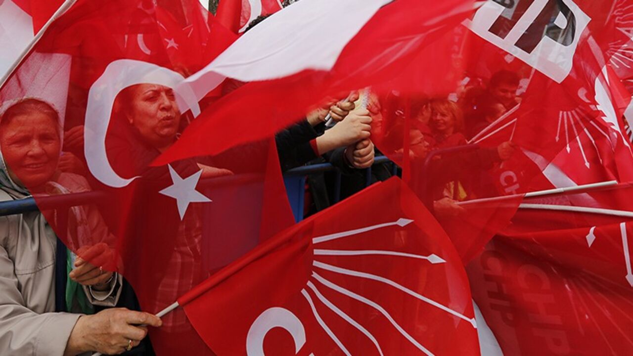 TURKEY-ELECTION/ Supporters of main opposition Republican People's Party (CHP) wave Turkish and party flags during an election campaign gathering in Istanbul March 27, 2014. To the adulation of the cheering crowds at his election rallies, Prime Minister Tayyip Erdogan paints a picture of an "evil alliance" plotting to topple him and break Turkey. In another place, on another day, his chief rival portrays him as a rogue doomed to jail or exile. Sunday's local polls have taken on a significance far beyond what anyone could ha