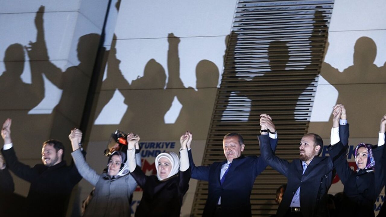 TURKEY-ELECTION/ Turkey's Prime Minister Tayyip Erdogan (3rd R) greets his supporters with his family members in Ankara March 31, 2014. Tayyip Erdogan's ruling AKP party appeared on Sunday to be heading for a clear victory in local polls that have become a referendum on a prime minister facing corruption scandals and security leaks he blames on "traitors" embedded in state bodies. Erdogan's family members from L to R are his son-in-law Berat Albayrak, his daughter Esra Erdogan Albayrak, his wife Emine, his son Bilal and his