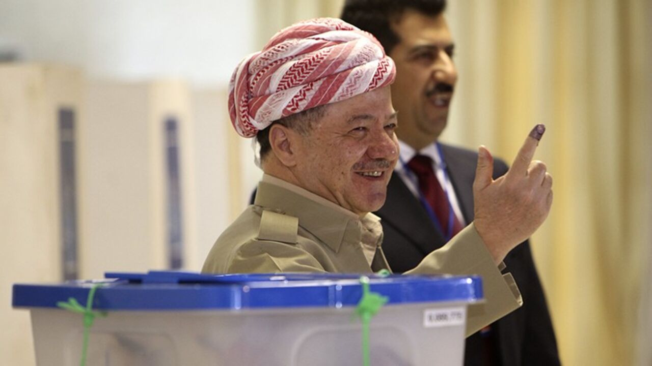 IRAQ-KURDS/ELECTION Iraq's Kurdistan President Masoud Barzani shows his ink-stained finger at a polling station in Arbil, capital of the autonomous Kurdistan region, about 350 km (217 miles) north of Baghdad, September 21, 2013. Iraqi Kurds went to the polls on Saturday to vote for a new parliament at a time when their oil-producing region is seeking greater autonomy from Baghdad, against a backdrop of violent instability in the rest of Iraq and the wider Middle East. REUTERS/Azad Lashkari (IRAQ - Tags: ELECTIONS POLITICS) -