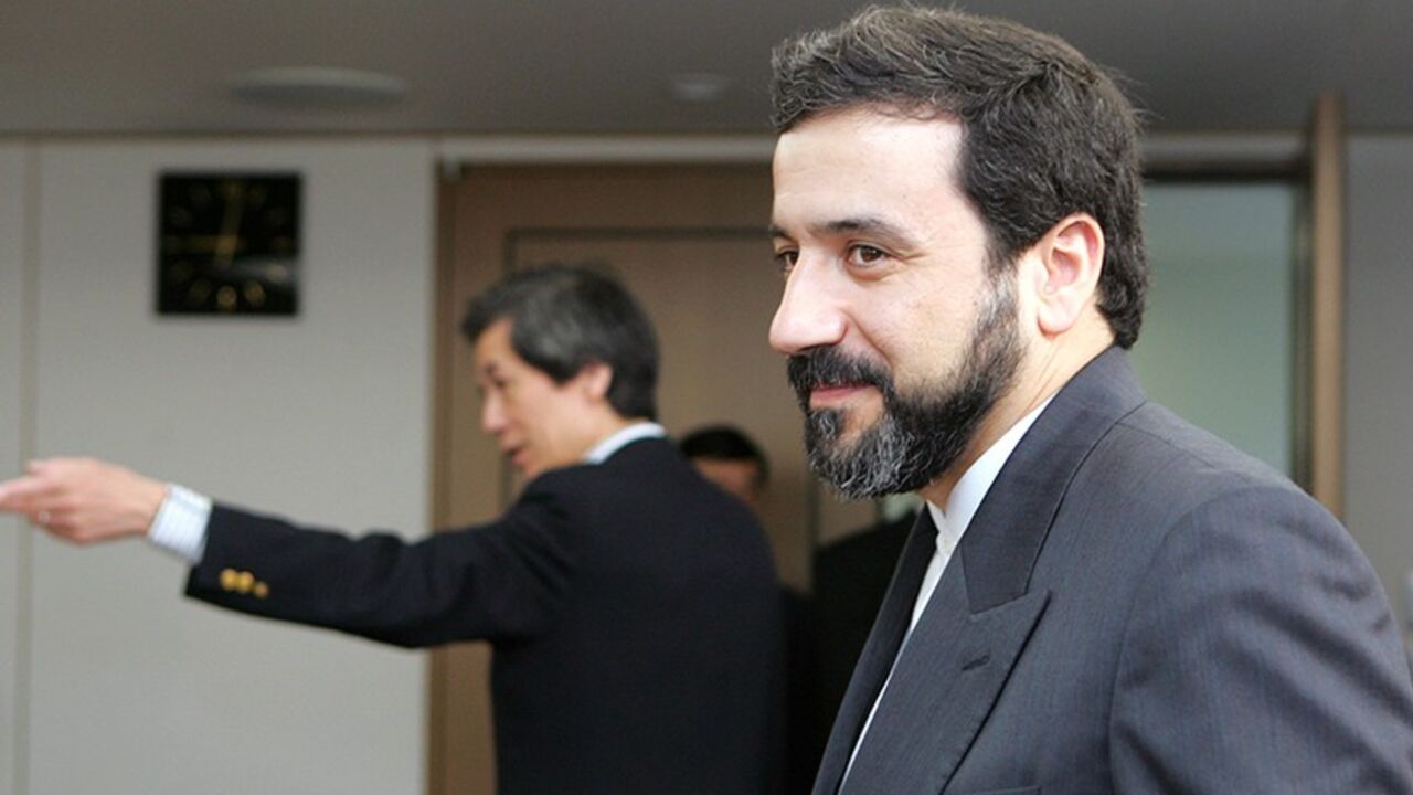 NUCLEAR IRAN JAPAN Iran's Deputy Foreign Minister Abbas Araghchi (R) is led by Japanese Deputy Minister for Foreign Affairs Tsuneo Nishida before their talks at the Foreign Ministry in Tokyo September 1, 2006. REUTERS/Toru Hanai (JAPAN) - RTR1GVI6