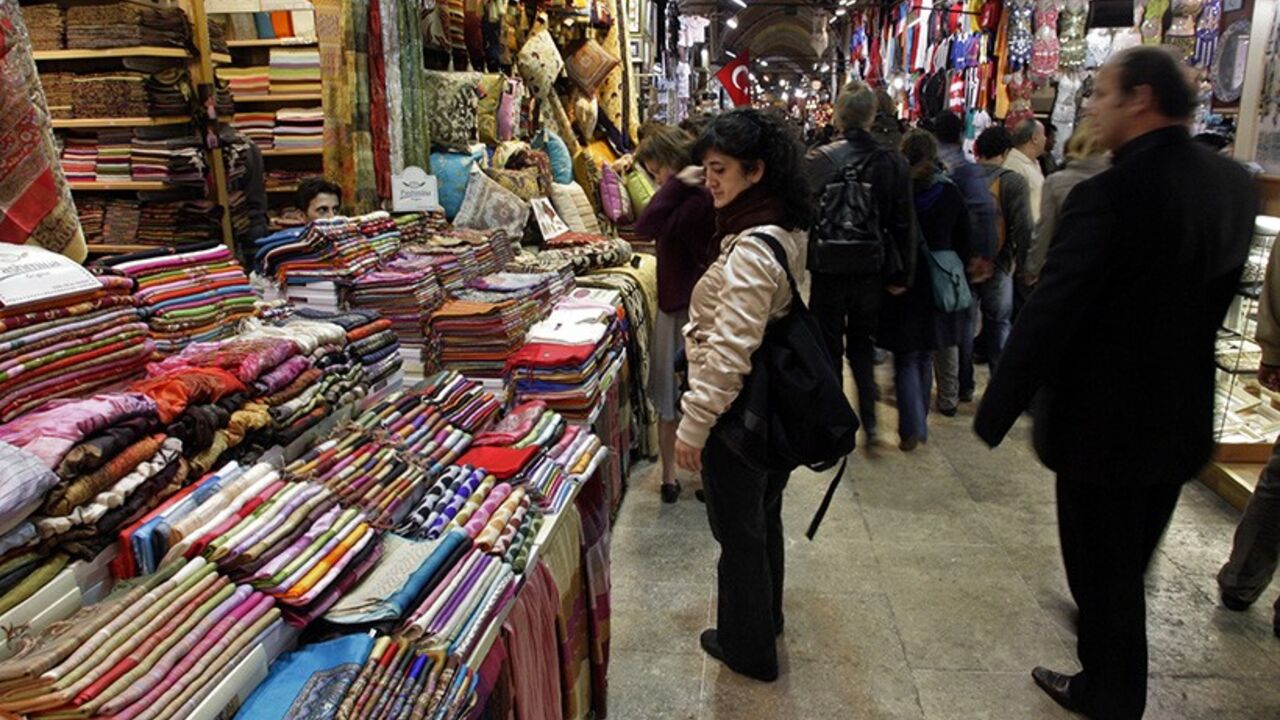 TURKEY-MALLS/ Shoppers walk in Grand Bazaar in Istanbul April 26, 2008. For hundreds of years Istanbul has lured intrepid travellers in search of the exotic carpets, jewelry and fabrics which filled the ancient alleways of the city's Grand Bazaar. Istanbul's shops are now more likely to entice customers with the wares of Nike, Samsung and GAP as shopping malls sprout across the city at a dizzying pace - a phenomenom which strikingly illustrates Turkey's emerging prosperity. To match Feature TURKEY-MALLS/ REUTERS/Osman