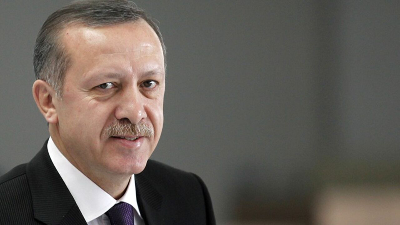 ARMENIA-TURKEY/ Turkey's Prime Minister Tayyip Erdogan arrives during a ceremony at the Constitutional Court in Ankara April 22, 2010. Armenia's ruling coalition on Thursday said it had decided to freeze the ratification in parliament of accords with Turkey aimed at normalising ties between the historic foes. REUTERS/Umit Bektas (TURKEY - Tags: POLITICS) - RTR2D3ZW