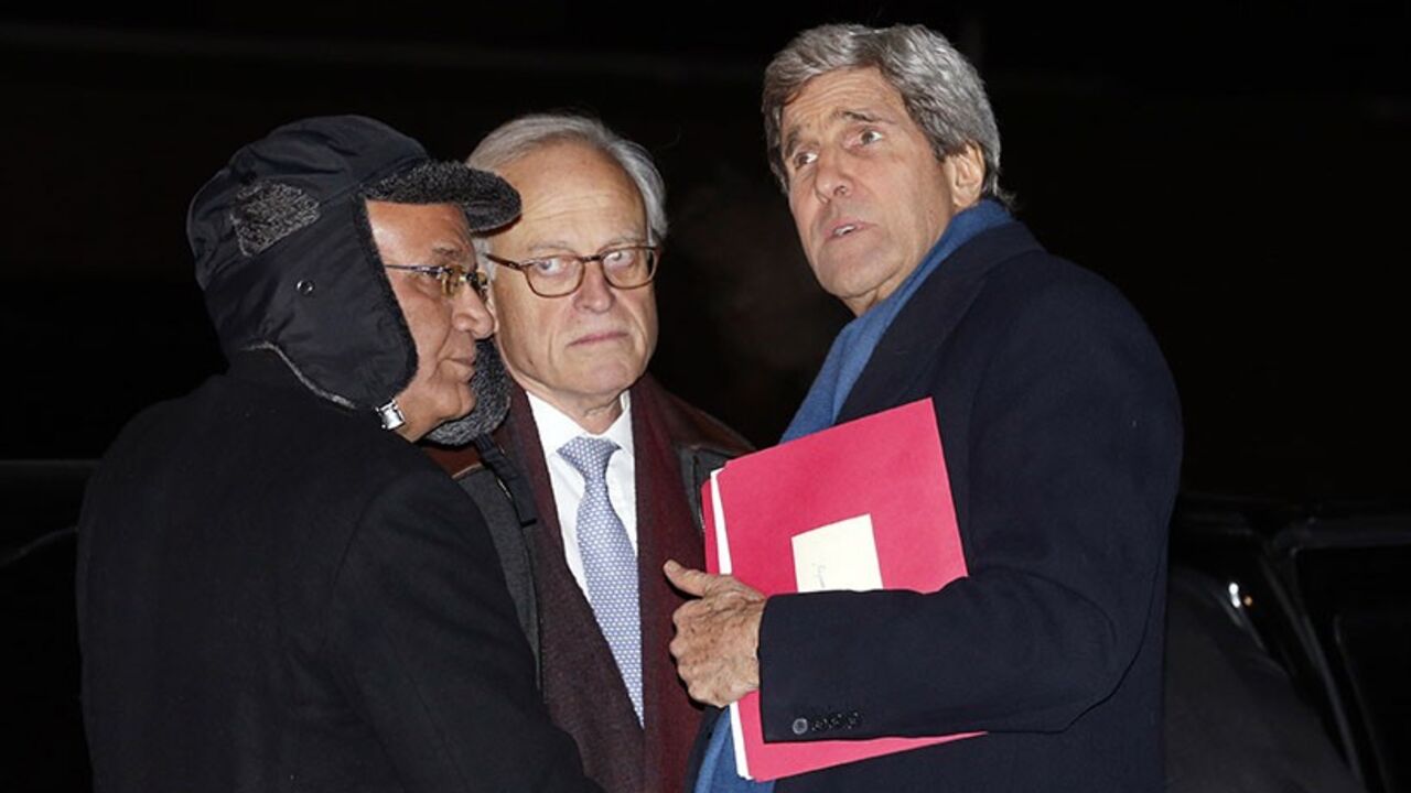 UKRAINE-CRISIS/ U.S. Secretary of State John Kerry (R) talks with Palestinian lead negotiator Saeb Erekat (L) and State Department Mideast advisor Martin Indyk as he departs Joint Base Andrews in Washington enroute to Ukraine March 3, 2014. In remarks today, U.S. President Barack Obama said Kerry will propose ways in which a negotiation between Russia and Ukraine could be overseen by a multilateral organization when he goes to Kiev on Tuesday. REUTERS/Kevin Lamarque (UNITED STATES - Tags: POLITICS) - RTR3G08L