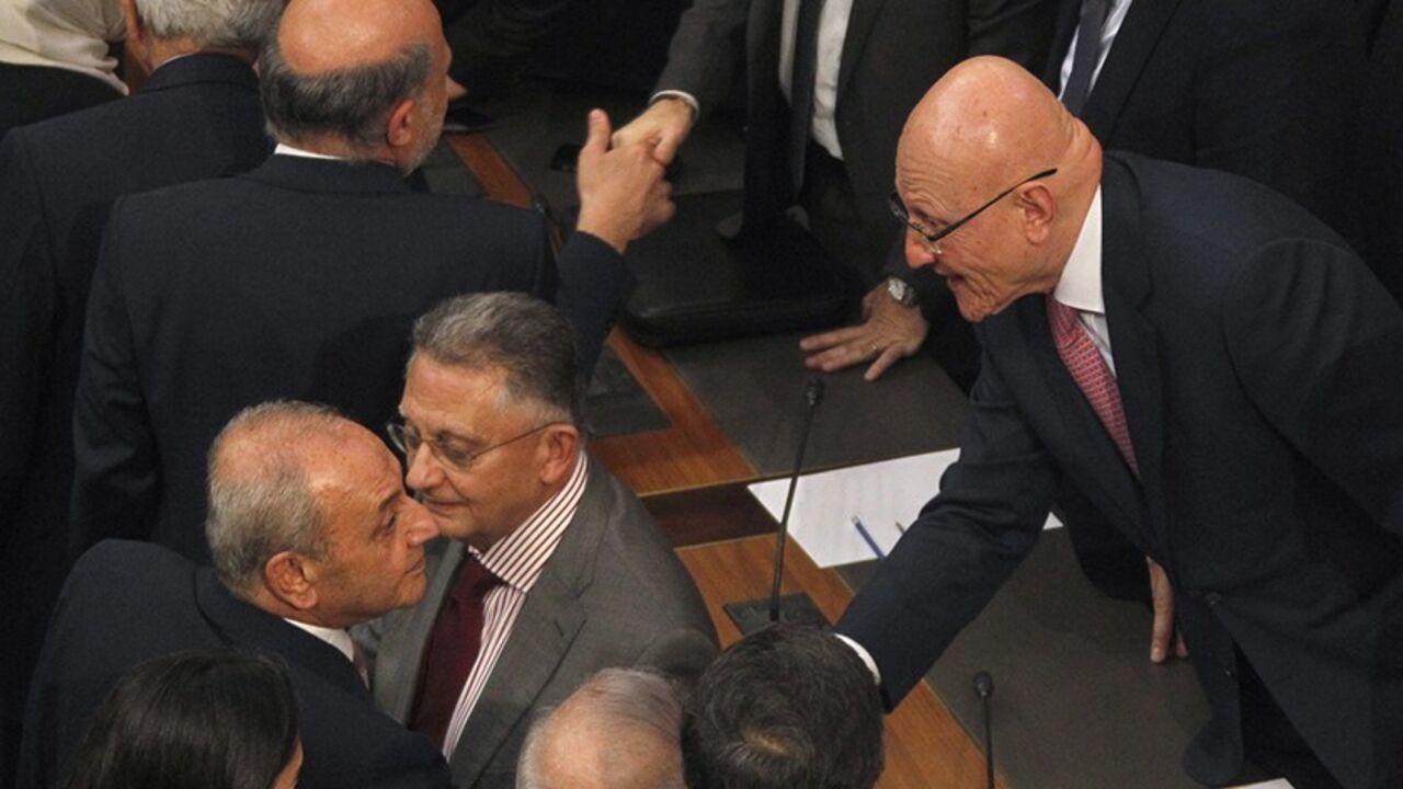LEBANON-PARLIAMENT/VOTE Lebanon's Parliament Speaker Nabih Berri shakes hands with Lebanon's Prime Minister Tammam Salam after his new government wins a vote of confidence in Beirut March 20, 2014. Lebanon's parliament gave a newly-formed cabinet a vote of confidence on Thursday, ending almost a year of political deadlock during which the country has been pulled further into the civil war in neighbouring Syria. REUTERS/Sharif Karim (LEBANON - Tags: POLITICS) - RTR3HXY5