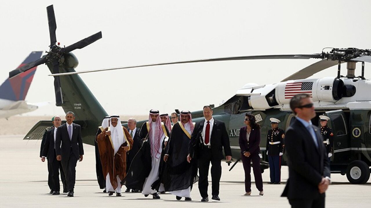 OBAMA-SAUDI/ U.S. President Barack Obama (2nd L) is escorted from Marine One to Air Force One as he departs Saudi Arabia to return to Washington March 29, 2014. Obama sought to reassure Saudi King Abdullah on Friday that he would support moderate Syrian rebels and reject a bad nuclear deal with Iran, during a visit designed to allay the kingdom's concerns that its decades-old U.S. alliance had frayed. REUTERS/Kevin Lamarque (SAUDI ARABIA - Tags: POLITICS) - RTR3J2HK
