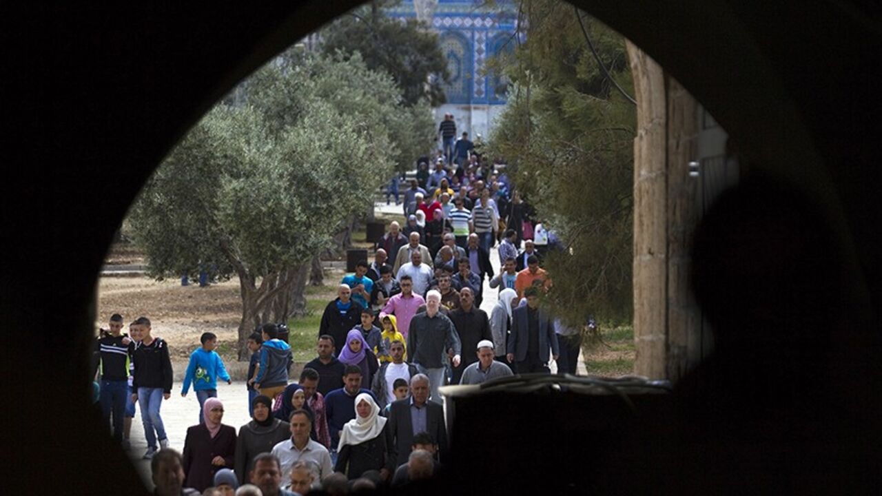 ISRAEL-PALESTINIAN/KERRY Palestinians leave the compound known to Muslims as Noble Sanctuary and to Jews as Temple Mount, after Friday prayers in Jerusalem's Old City April 4, 2014. U.S. Secretary of State John Kerry said on Friday Washington was evaluating whether to continue its role in Middle East peace talks, signalling his patience with the Israelis and Palestinians was running out. REUTERS/Amir Cohen (JERUSALEM - Tags: SOCIETY RELIGION) - RTR3JXYO