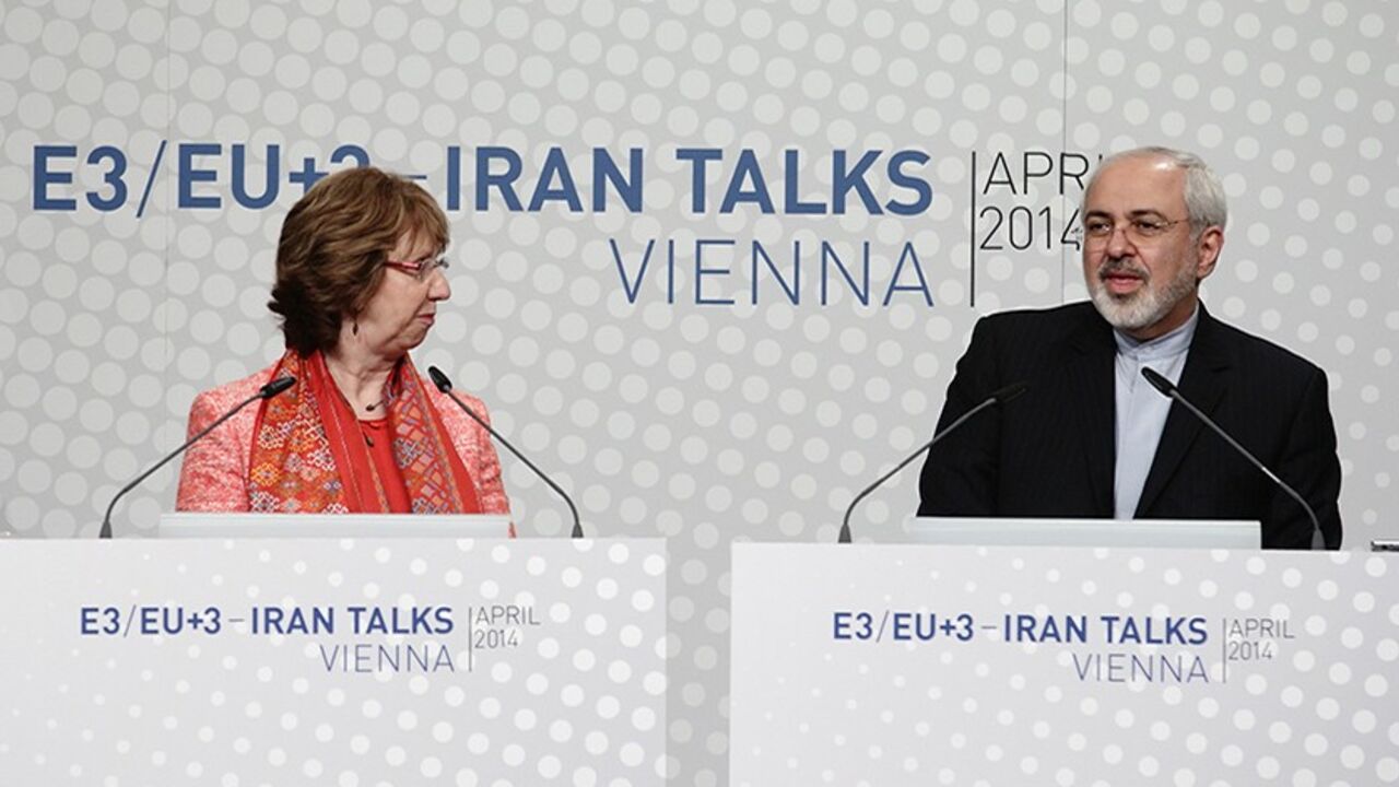 IRAN-NUCLEAR/ European Union foreign policy chief Catherine Ashton (L) and Iranian Foreign Minister Mohammad Javad Zarif address a news conference after talks in Vienna April 9, 2014. Six world powers and Iran will need "a lot of intensive work" to bridge differences during talks over Tehran's nuclear programme, Ashton said on Wednesday after their latest meeting. REUTERS/Heinz-Peter Bader (AUSTRIA - Tags: POLITICS ENERGY TPX IMAGES OF THE DAY) - RTR3KKLC
