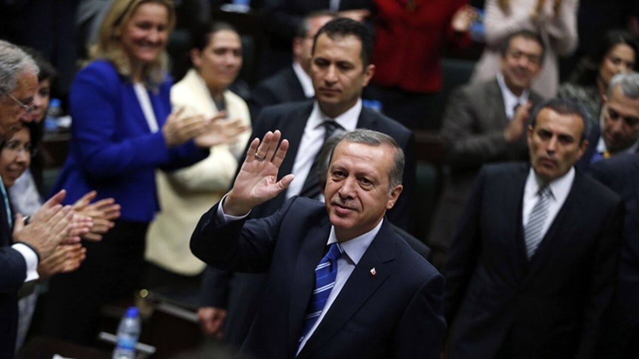 TURKEY-ERDOGAN/ Turkey's Prime Minister Tayyip Erdogan greets members of parliament from his ruling AK Party (AKP) as he arrives a meeting at the Turkish parliament in Ankara April 29, 2014. REUTERS/Umit Bektas (TURKEY - Tags: POLITICS) - RTR3N1W3