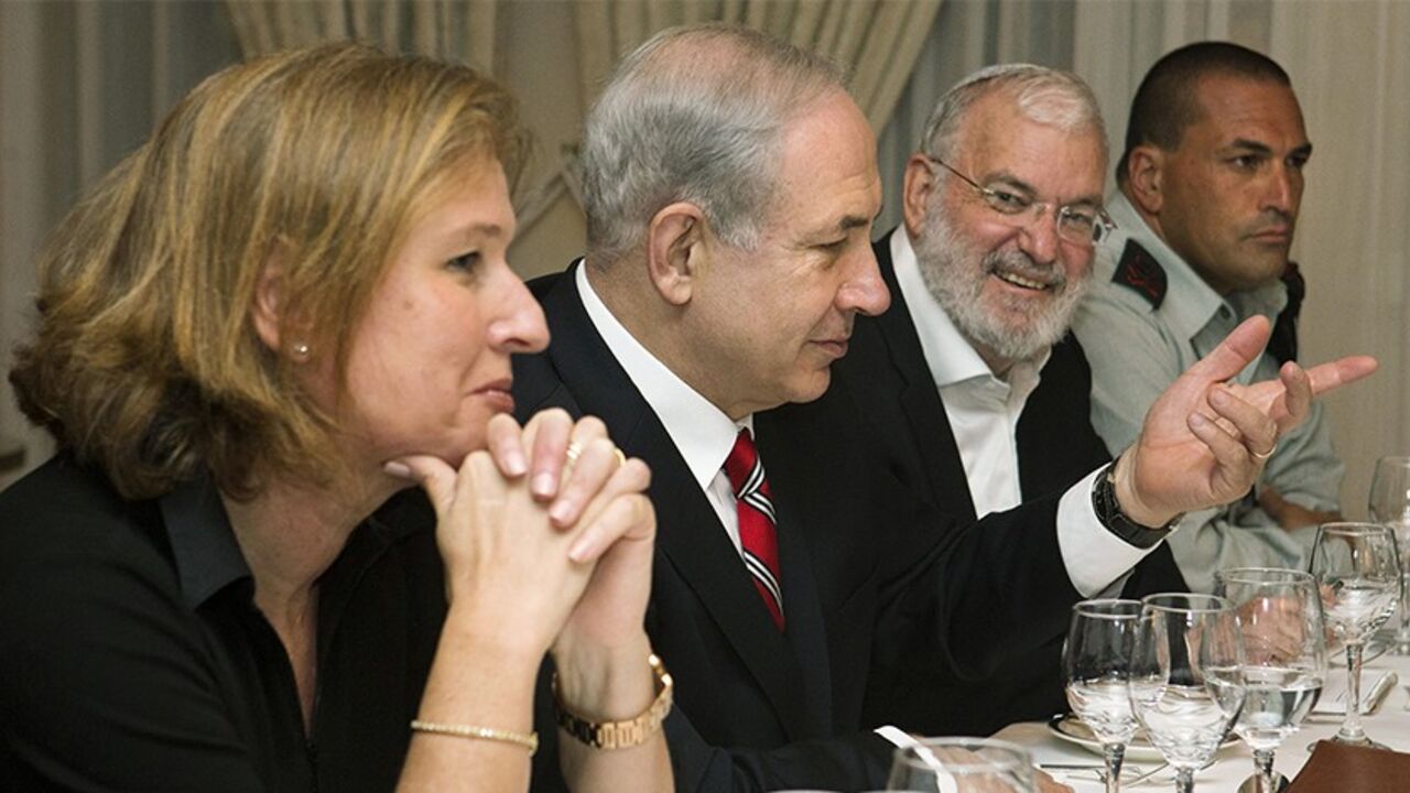 MIDEAST-USA/ Israel's Prime Minister Benjamin Netanyahu (2nd L), flanked by Tzipi Livni (L), Israel's chief negotiator with the Palestinians, National Security Adviser Yaakov Amidror (3rd L) and Military Secretary Eyal Zamir, speaks with U.S. Secretary of State John Kerry (not pictured) during a meeting in Jerusalem June 29, 2013. Kerry extended his Middle East peace mission on Saturday, shuttling between Jerusalem and Amman for more talks with Israeli and Palestinian leaders on reviving their stalled negotiations. REUT