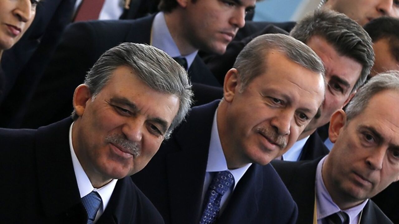 TURKEY/ Turkish President Abdullah Gul (L) and Prime Minister Tayyip Erdogan arrive at an opening ceremony of a new line of the Ankara Metro in Ankara February 12, 2014. REUTERS/Umit Bektas (TURKEY - Tags: POLITICS) - RTX18NXZ