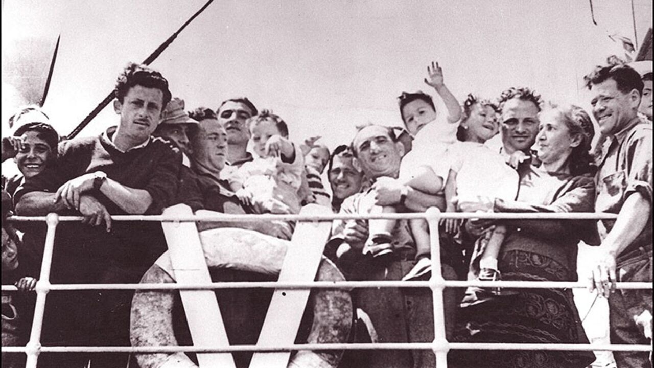 SAPA980303293460 TEL-AVIV, ISRAEL: The crowd of Jewish immigrants waving from the deck of trawler "Andria" as they arrive 20 May 1948 at Tel Aviv harbor. Israel was founded on 14 May 1948 by the Jewish National Council and was recognized by the United States and the Soviet Union 15 and 17 May. (Photo credit should read AFP/Getty Images)