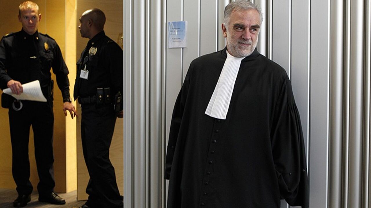 ICC-BENSOUDA/ Outgoing International Criminal Court (ICC) prosecutor Luis Moreno-Ocampo (R) of Argentina leaves after the swearing-in ceremony to install Fatou Bensouda of Gambia as his successor at the International Criminal Court (ICC) in The Hague, Netherlands June 15, 2012. REUTERS/Bas Czerwinski/Pool (NETHERLANDS - Tags: CRIME LAW POLITICS) - RTR33ND1