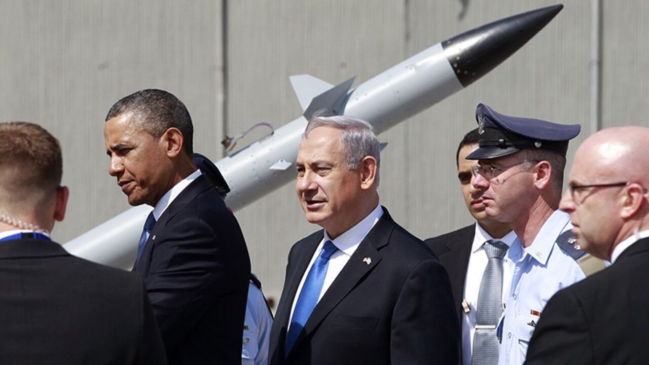 PALESTINIANS-ISRAEL/OBAMA U.S. President Barack Obama and Israeli Prime Minister Benjamin Netanyahu (C) view an Iron Dome missile defense battery at Ben Gurion International Airport in Tel Aviv March 20, 2013. Obama said at the start of his first official visit to Israel on Wednesday that the U.S. commitment to the security of the Jewish state was rock solid and that peace must come to the Holy Land. REUTERS/Jason Reed (ISRAEL - Tags: POLITICS MILITARY) - RTR3F821