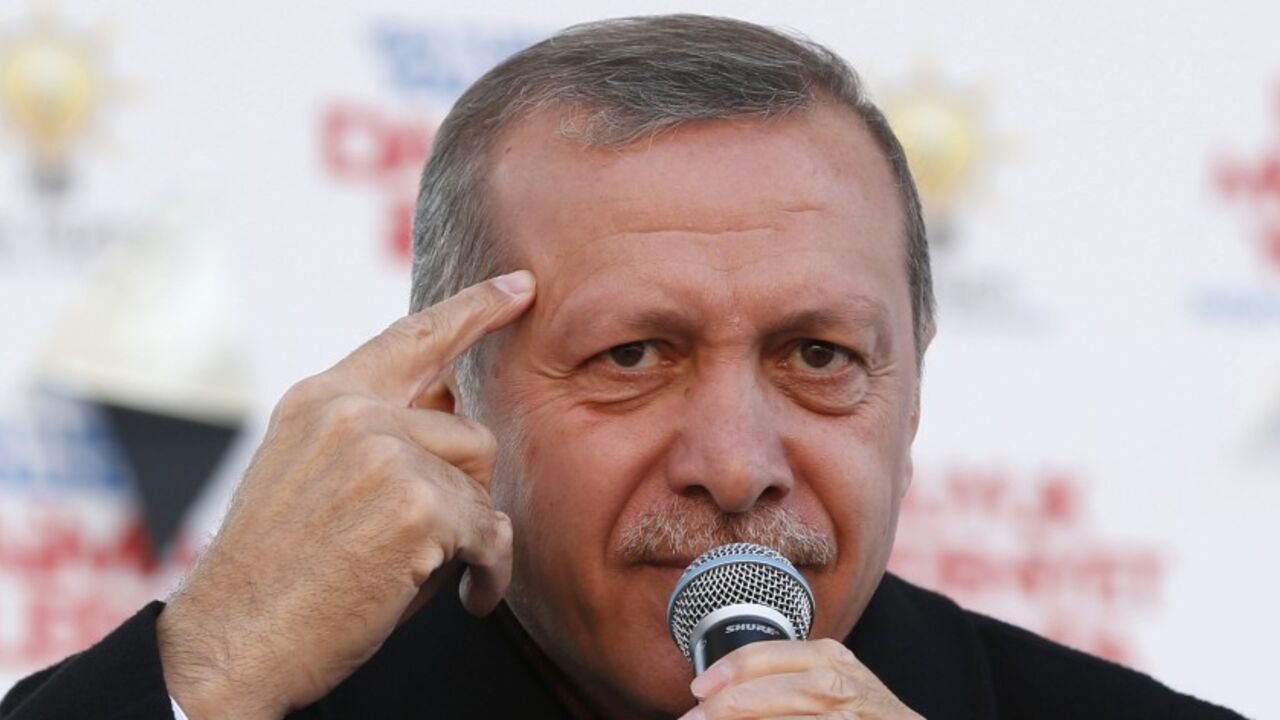 TURKEY-ELECTION/ Turkish Prime Minister Tayyip Erdogan speaks during an election rally of his ruling AK Party in Istanbul March 29, 2014. Turkey has started an espionage investigation after a discussion between top officials on potential military action in Syria was leaked on YouTube, heralding a possible government crackdown on its political opponents after elections on Sunday. The recording of the meeting between Turkey's intelligence chief, foreign minister and deputy head of the military was by far the most serious brea