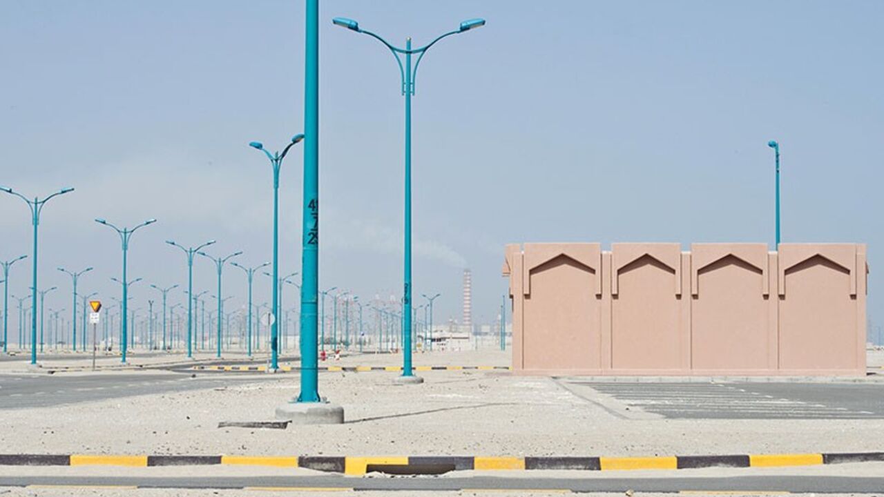KUWAIT-DECLINE/ Sand covers the empty infrastructure at an abandoned housing project in Khairan, southern Kuwait March 6, 2014. With a youthful, well-educated population, strong relationships with both neighbours and world powers, and a strategic location on the Gulf, major oil producer Kuwait should be as dynamic a hub for the region as Dubai or Doha. But while others in the Gulf have powered ahead, attracting foreign investment and developing infrastructure, Kuwait has stagnated, frustrating the people of a country once