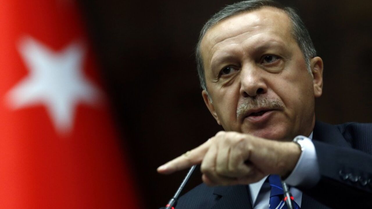 Turkey's Prime Minister Tayyip Erdogan addresses members of parliament from his ruling AK Party during a meeting at the Turkish parliament in Ankara Turkey's Prime Minister Tayyip Erdogan addresses members of parliament from his ruling AK Party (AKP) during a meeting at the Turkish parliament in Ankara April 29, 2014. REUTERS/Umit Bektas (TURKEY - Tags: POLITICS) - RTR3N1XI