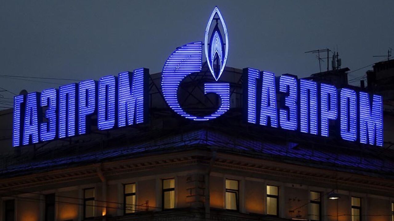 RWE-RESULTS/GASTRADING The company logo of Russian natural gas producer Gazprom is seen on an advertisement installed on the roof of a building in St. Petersburg, November 14, 2013. Repayments made by Russia's Gazprom to German utility RWE for gas purchases going back to 2010 helped drive earnings at RWE's trading unit 1.3 billion euros ($1.7 billion) higher in the first nine months of this year, RWE said on Thursday. REUTERS/Alexander Demianchuk (RUSSIA - Tags: BUSINESS ENERGY) - RTX15DDT