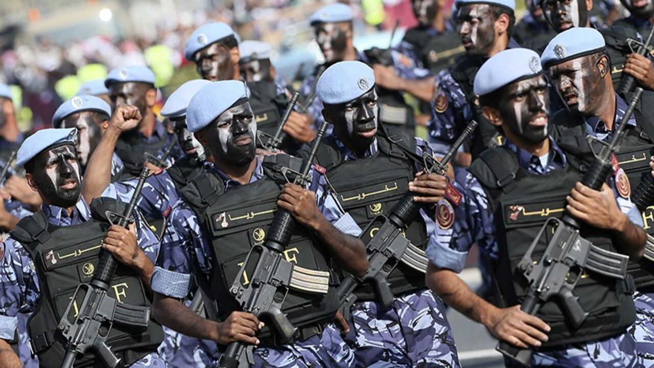 Members of the Qatari Armed Forces take part in a military parade during National Day celebrations in Doha December 18, 2013. REUTERS/Mohammed Dabbous (QATAR - Tags: MILITARY ANNIVERSARY POLITICS) - RTX16N6N
