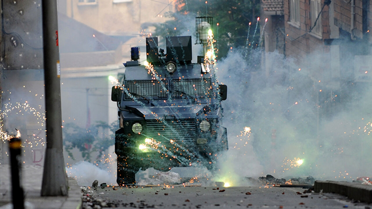 TURKEY-KURDS-UNREST Fireworks thrown by Kurdish protestors burst in front of a riot police vehicle during a clashes with riot police on June 8, 2014 at Okmeydani district in Istanbul. The demonstration followed the death of a man during clashes with Turkish soldiers the night before in Lice, southeastern Turkey. Two Kurdish protesters have died of gunshot wounds sustained during fierce clashes with Turkish soldiers in the country's southeast on June 7. Three people, including two soldiers, were hospitalised after the demonstra