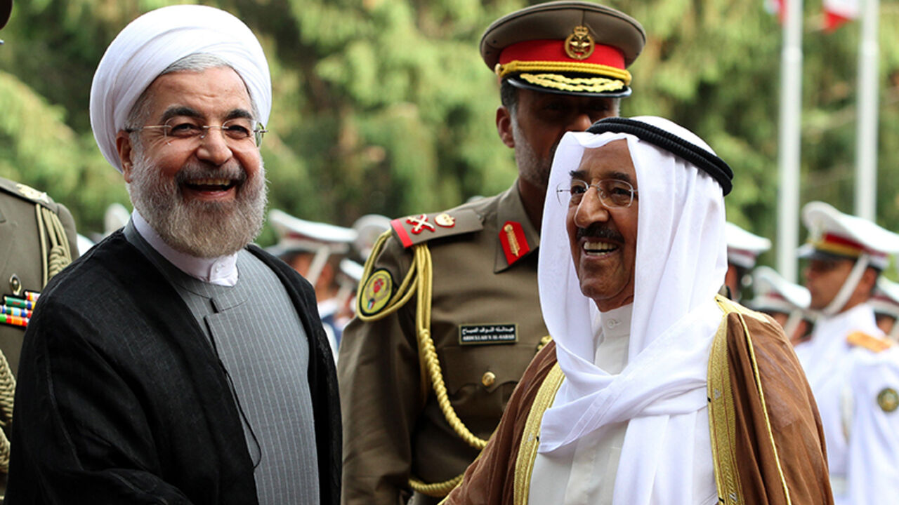 IRAN-KUWAIT-DIPLOMACY Iranian President Hassan Rouhani (L) greets Emir of Kuwait, Sheikh Sabah al-Ahmad al-Sabah (R) upon his arrival in Tehran on June 1, 2014. Kuwait's Emir started a landmark visit to Tehran focused on mending fences between Shiite Iran and the Sunni-ruled monarchies in the Gulf. AFP PHOTO/ATTA KENARE (Photo credit should read ATTA KENARE/AFP/Getty Images)