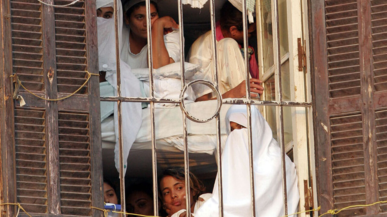 Women prisoners look out a barred window of Al-Qanater prison in Cairo Women prisoners look out a barred window of Al-Qanater prison in Cairo October 6, 2007. Egypt's Interior Ministry invited representatives from the Egyptian Organization for Human Rights to visit the prison, after complaints of human rights violation were made by inmates in the prison. REUTERS/Nasser Nuri (EGYPT) - RTR1UNPQ