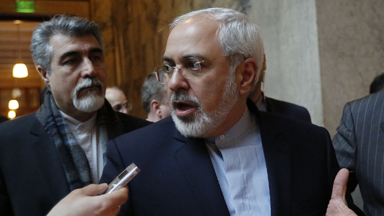 Iranian Foreign Minister Zarif talks to journalists in the Parliament in Vienna Iranian Foreign Minister Mohammad Javad Zarif talks to journalists as he visits the Parliament in Vienna March 19, 2014. Zarif said on Wednesday he was optimistic that Tehran and six world powers can reach a broad settlement in their nuclear dispute by a July 20 deadline. REUTERS/Leonhard Foeger (AUSTRIA - Tags: POLITICS) - RTR3HPFF
