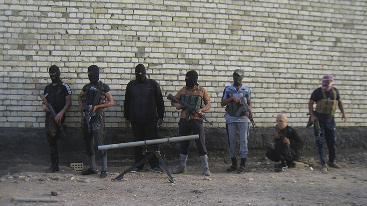 Masked Sunni gunmen pose for a photo during a patrol outside the city of Falluja Masked Sunni gunmen pose for a photo during a patrol outside the city of Falluja April 28, 2014. Iraqi soldiers say they have been trapped in and around the western city of Ramadi. They say they have run low on tank shells, lack aerial cover and armoured vehicles, and have been hit by high casualties and desertion rates. In March and April, ISIL seized a dam in Fallujah, flooded farmland on the outskirts of Baghdad in Abu Ghraib, and drained offshoots of the Euphrates river; the Iraqi government evacuated t