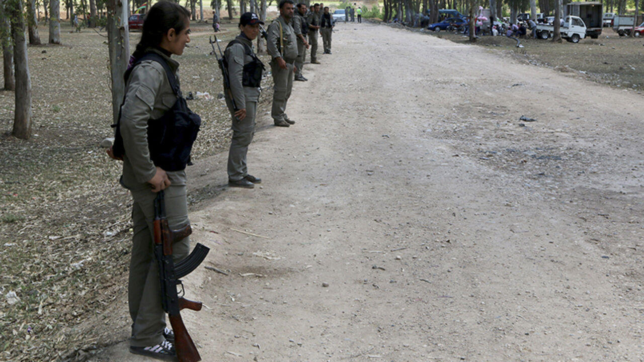 Kurdish Democratic Union Party (PYD) members stand guard during a Labour Day celebration in Efrin Kurdish Democratic Union Party (PYD) members stand guard during a Labour Day celebration in Efrin May 1, 2014. REUTERS/Mahmoud Hebbo (SYRIA - Tags: POLITICS CIVIL UNREST SOCIETY) - RTR3NEUG