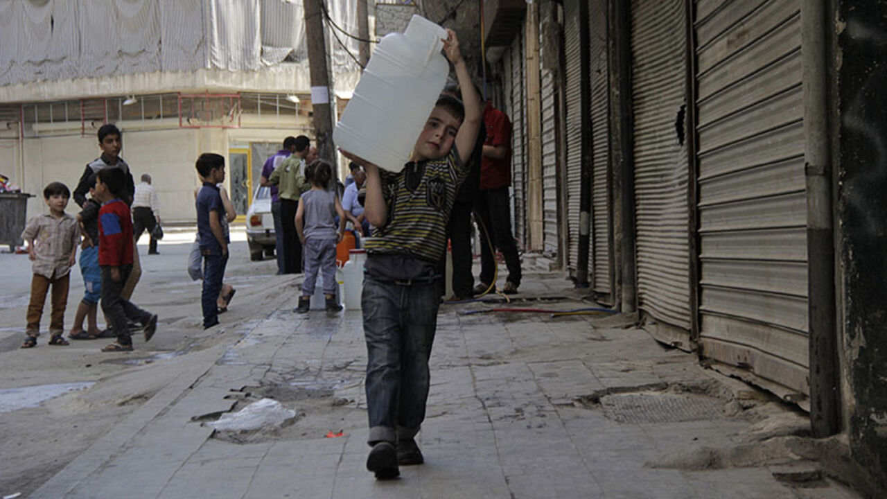 A boy carries a water container filled with water sourced from underground wells in Aleppo A boy carries a water container filled with water sourced from underground wells in Aleppo May 10, 2014. Activists say the water supply in the area has been cut off for more than a week. REUTERS/Aref Haj Youssef (SYRIA - Tags: POLITICS CIVIL UNREST CONFLICT SOCIETY) - RTR3OL64