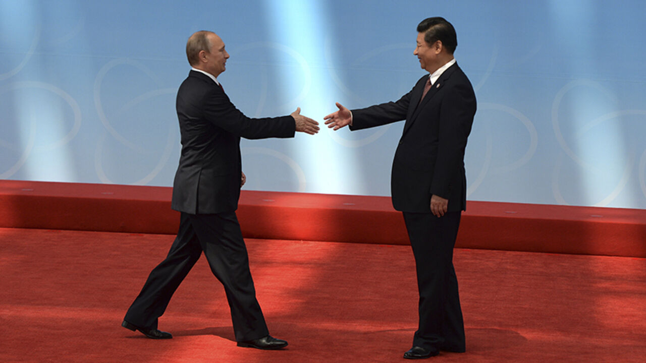 Russia's President Putin is greeted by his Chinese counterpart Xi before the opening ceremony of the CICA summit in Shanghai Russia's President Vladimir Putin (L) is greeted by his Chinese counterpart Xi Jinping before the opening ceremony of the fourth Conference on Interaction and Confidence Building Measures in Asia (CICA) summit in Shanghai May 21, 2014. REUTERS/Mark Ralston/Pool (CHINA - Tags: POLITICS) - RTR3Q3LZ