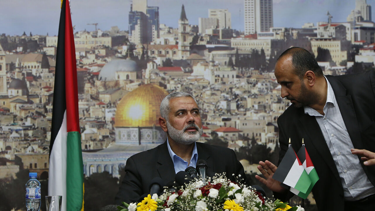 Senior Hamas leader Ismail Haniyeh prepares to deliver a farewell speech for his former position as a Hamas government Prime Minister, in Gaza City Senior Hamas leader Ismail Haniyeh prepares to deliver a farewell speech for his former position as a Hamas government Prime Minister, in Gaza City June 2, 2014. Palestinian President Mahmoud Abbas swore in a unity government on Monday after overcoming a last-minute dispute with the Hamas Islamist group. REUTERS/Suhaib Salem (GAZA - Tags: POLITICS) - RTR3RTNG