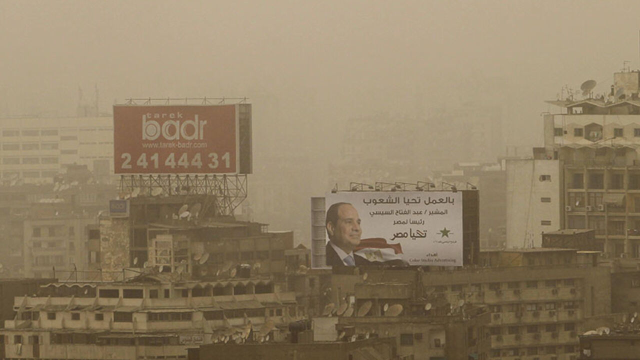 A billboard of president and former army chief Abdel Fattah al-Sisi is seen on top of a building as sandstorm hits the city of Cairo A billboard of president and former army chief Abdel Fattah al-Sisi is seen on top of a building as sandstorm hits the city of Cairo, June 4, 2014. Former army chief Abdel Fattah al-Sisi won 96.91 percent in Egypt's presidential vote last week, the election commission said on Tuesday, confirming interim results that had given him a landslide victory. REUTERS/Amr Abdallah Dalsh (EGYPT - Tags: POLITICS ENVIRONMENT SOCIETY) - RTR3S7JO