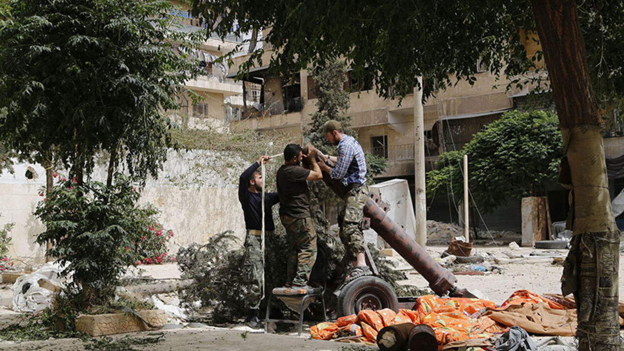 Members of Islamist rebel group Nusra Front prepare a home made mortar in Aleppo's Bustan al-Qasr neighborhood Members of Islamist rebel group al-Nusra Front prepare a home made mortar in Aleppo's Bustan al-Qasr neighborhood June 5, 2014. REUTERS/Hamid Khatib (SYRIA - Tags: POLITICS CIVIL UNREST CONFLICT) - RTR3SE8K