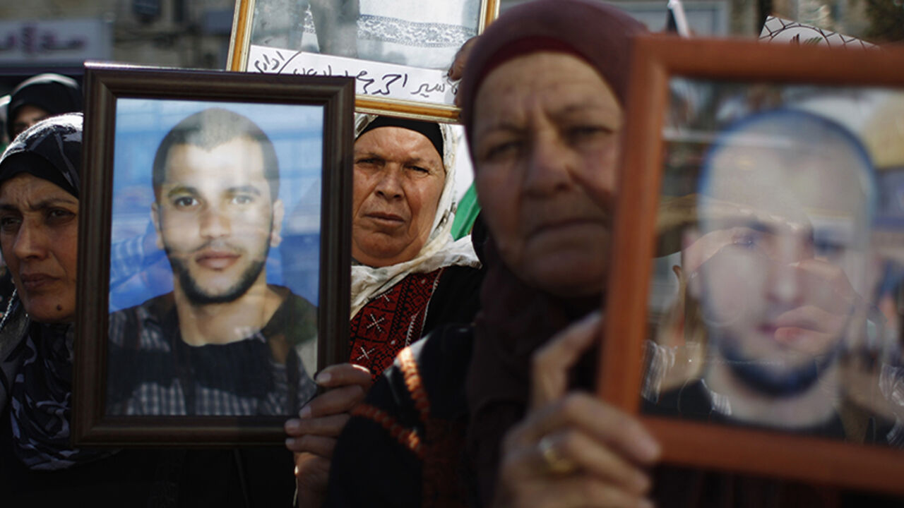 Palestinians hold pictures of prisoners during demonstration in support of Palestinian prisoners on hunger strike in Israeli jails, in Ramallah Palestinians hold pictures of prisoners during a demonstration in support of Palestinian prisoners on hunger strike in Israeli jails, in the West Bank city of Ramallah June 7, 2014. U.N. Secretary-General Ban Ki-moon voiced concerns on Friday about the worsening health of Palestinian hunger strikers in Israeli detention and demanded that they either be formally charged or released immediately. Some 120 Palestinians jailed without trial in Israel have been on an open-ended hunger strike, eating only salt and
