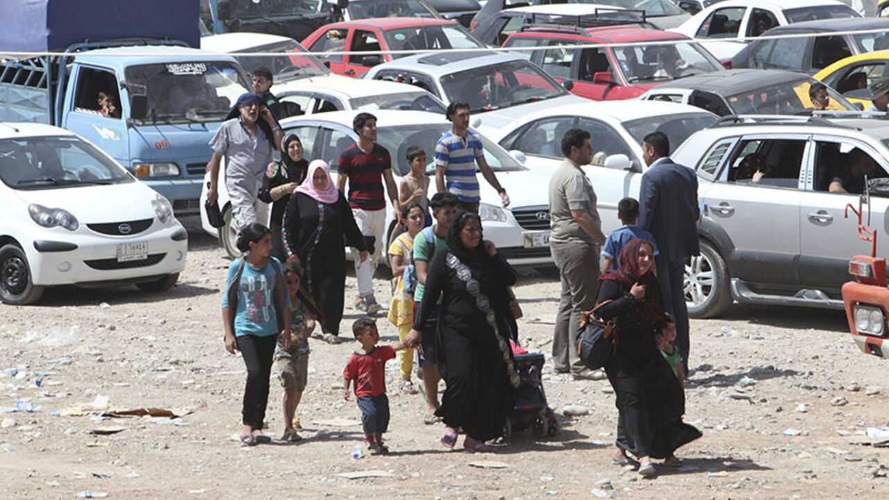 Families fleeing the violence in the Iraqi city of Mosul arrive at a checkpoint in outskirts of Arbil Families fleeing the violence in the Iraqi city of Mosul arrive at a checkpoint in outskirts of Arbil, in Iraq's Kurdistan region, June 10, 2014. Radical Sunni Muslim insurgents seized control of most of Iraq's second largest city of Mosul early on Tuesday, overrunning a military base and freeing hundreds of prisoners in a spectacular strike against the Shi'ite-led Iraqi government. REUTERS/Azad Lashkari (IRAQ - Tags: CIVIL UNREST POLITICS MILITARY) - RTR3T260