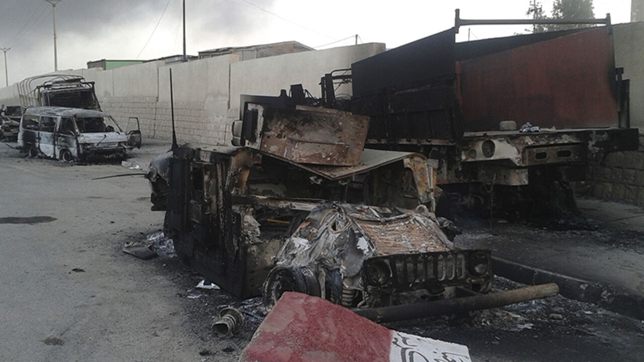 Burnt vehicles are seen during clashes between Iraqi security forces and al Qaeda-linked Islamic State in Iraq and the Levant (ISIL) in the northern Iraq city of Mosul Burnt vehicles are seen during clashes between Iraqi security forces and al Qaeda-linked Islamic State in Iraq and the Levant (ISIL) in the northern Iraq city of Mosul, June 10, 2014. Radical Sunni Muslim insurgents seized control of most of Iraq's second largest city of Mosul early on Tuesday, overrunning a military base and freeing hundreds of prisoners in a spectacular strike against the Shi'ite-led Iraqi government. REUTERS/Stringer (IRAQ - Tags: CIVIL UNREST POLITICS) - RTR3T3UD