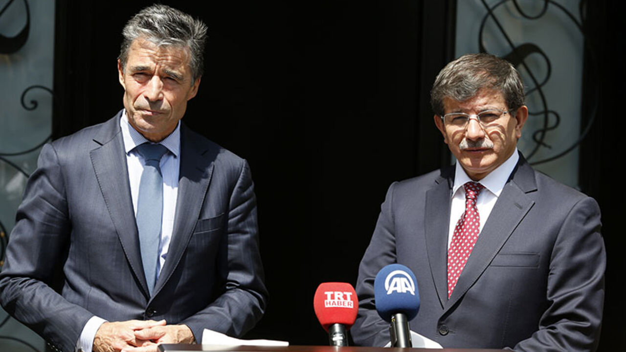 NATO Secretary-General Anders Fogh Rasmussen and Turkey's Foreign Minister Ahmet Davutoglu attend a news conference in Ankara NATO Secretary-General Anders Fogh Rasmussen (L) and Turkey's Foreign Minister Ahmet Davutoglu attend a news conference in Ankara June 16, 2014. REUTERS/Umit Bektas (TURKEY - Tags: POLITICS) - RTR3U04T