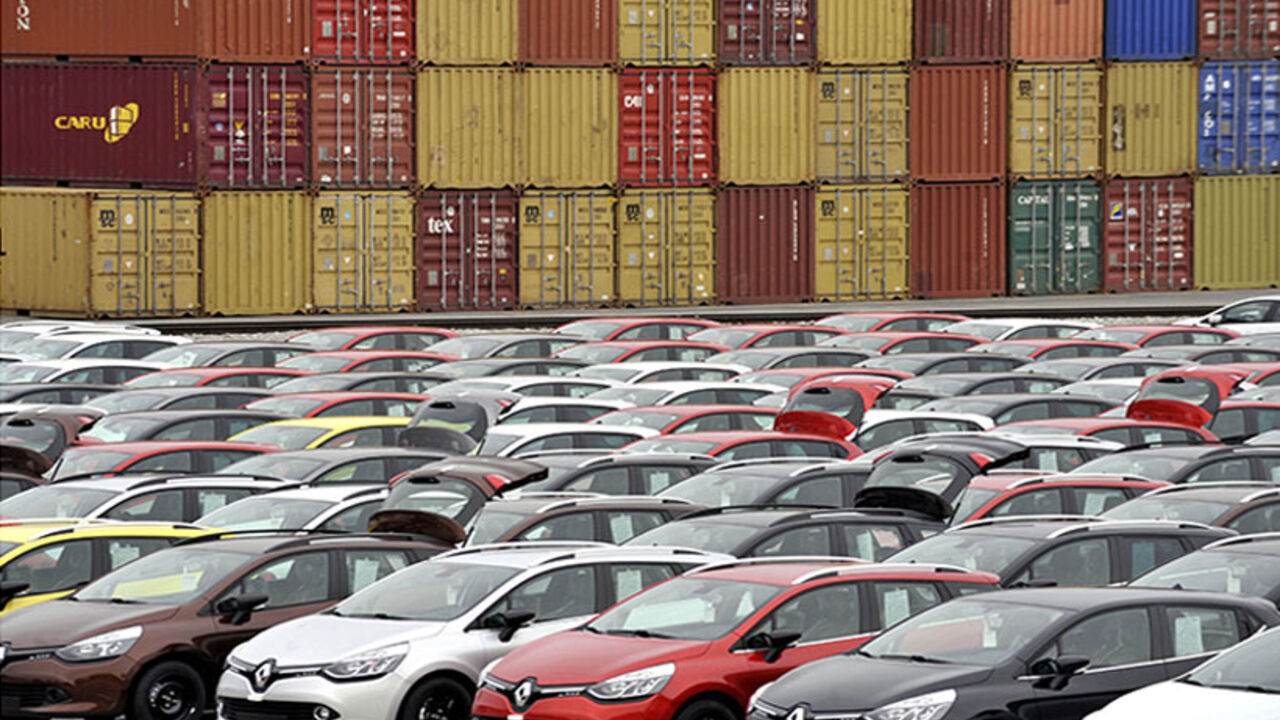 Renault cars produced in Turkey and awaiting export throughout Europe, are lined-up in front of ship containers in the port of Koper October 14, 2013. Automotive industry association ACEA said October 16, 2013, that new car registrations in Europe climbed 5.5 percent to 1.19 million vehicles in September, only the third month a gain was recorded in the past two years. But within the European Union, the level of demand was the second lowest on record for the month of September since it began tabulating resul