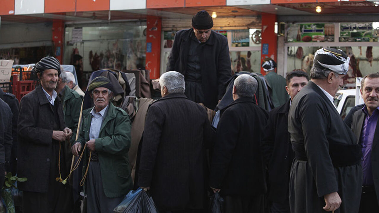 Iraqi Kurdish men chat on a street in the Kurdish town of Halabja Iraqi Kurdish men chat on a street in the Kurdish town of Halabja, near Sulaimaniya, 260 km (160 miles) northeast of Baghdad, February 1, 2014. Picture taken February 1, 2014. To match IRAQ-KURDS/SYRIA REUTERS/Yahya Ahmad (IRAQ - Tags: SOCIETY POLITICS CONFLICT) - RTX1877X