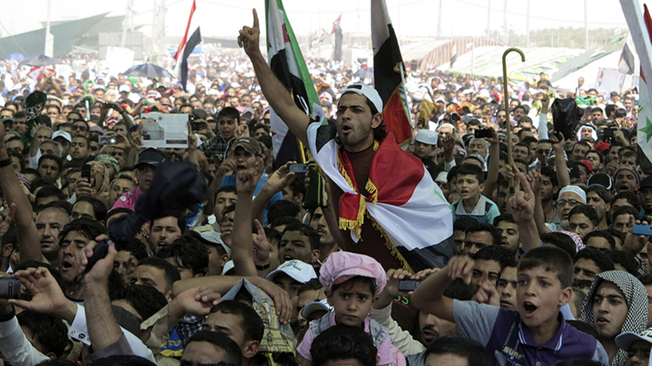 Iraqi Sunni Muslims take part in an anti-government demonstration in Ramadi Iraqi Sunni Muslims take part in an anti-government demonstration in Ramadi, 100 km (62 miles) west of Baghdad,April 19, 2013. Thousands of Sunni Muslims protested after Friday prayers in huge rallies against Shi'ite Iraqi Prime Minister Nuri al-Maliki, demanding that he step down. REUTERS/Ali al-Mashhadani (IRAQ - Tags: RELIGION POLITICS CIVIL UNREST) - RTXYSEV