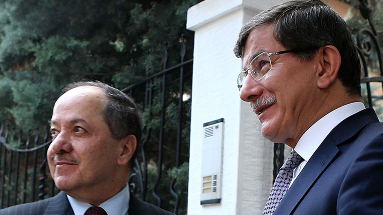TURKEY-IRAQ-DAVUTOGLU-BARZANI Turkish Foreign Minister Ahmet Davutoglu (R) greets the president of Iraq's autonomous Kurdish region, Massud Barzani, on July 14, 2014 before their meeting in Ankara as Turkey closely watches moves for an independent Iraqi Kurdistan amid the chaos in its conflict-torn neighbor. AFP PHOTO / ADEM ALTAN (Photo credit should read ADEM ALTAN/AFP/Getty Images)