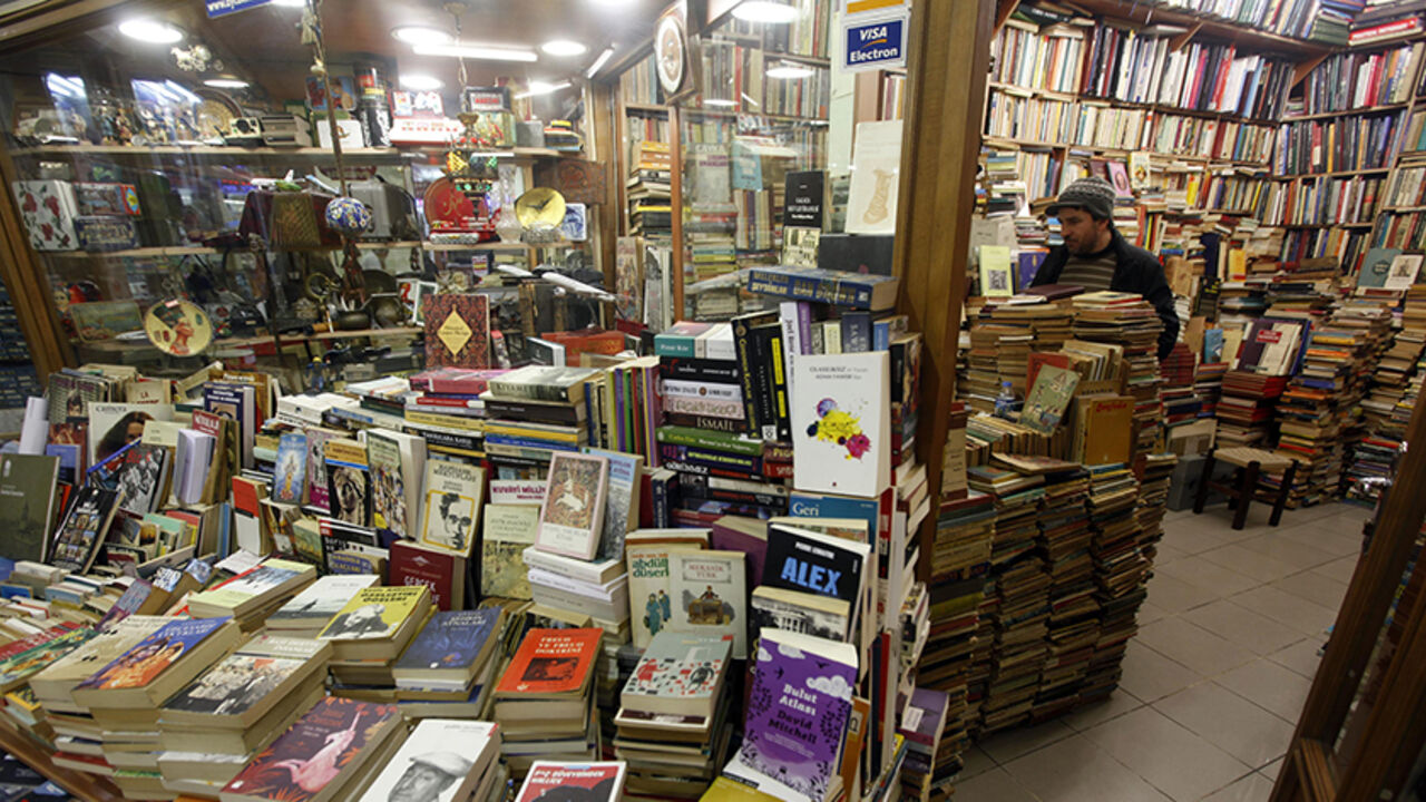 A man searches for a book in a second hand book market in Istanbul A man searches for a book in a second hand book market in Istanbul March 14, 2012. REUTERS/Osman Orsal (TURKEY - Tags: SOCIETY) - RTR2ZBHM