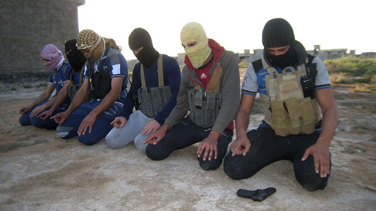 Masked Sunni gunmen pray during a patrol outside the city of Falluja Masked Sunni gunmen pray during a patrol outside the city of Falluja April 23, 2014. Government forces are fighting rebellious Sunni tribes and an al-Qaeda splinter group, the Islamic State in Iraq and the Levant (ISIL), in western Anbar province. REUTERS/Stringer (IRAQ - Tags: CIVIL UNREST POLITICS CONFLICT) - RTR3MDCC