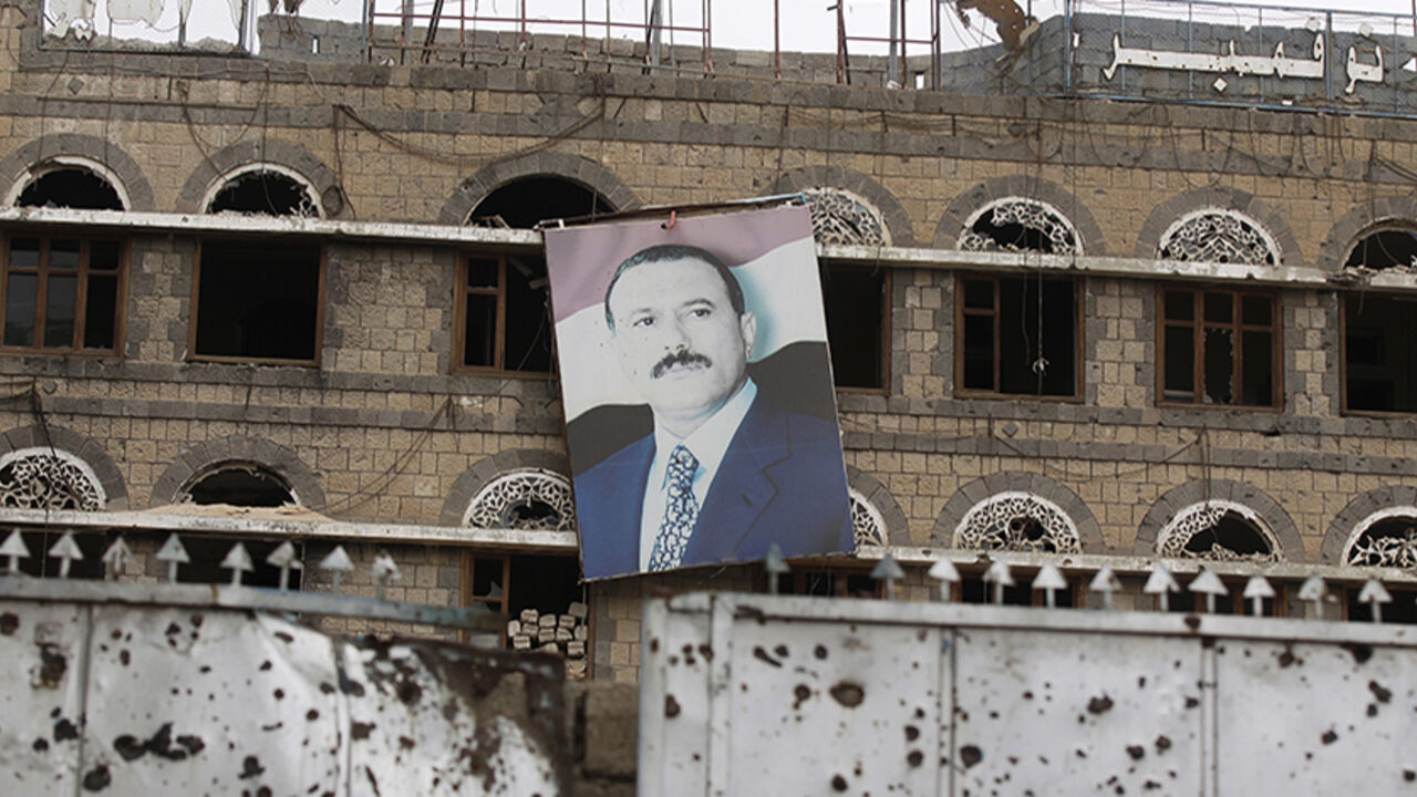 A portrait of Yemen's former president Saleh hangs on wall of former headquarters of General People's Congress party in Sanaa A portrait of Yemen's former president Ali Abdullah Saleh hangs on the wall of the former headquarters of his General People's Congress party in Sanaa May 12, 2014. The building was damaged during the 2011 clashes between forces loyal to Saleh and tribal militias opposing him during the uprising against his rule. REUTERS/Khaled Abdullah (YEMEN - Tags: POLITICS CIVIL UNREST TPX IMAGES OF THE DAY) - RTR3OTK8