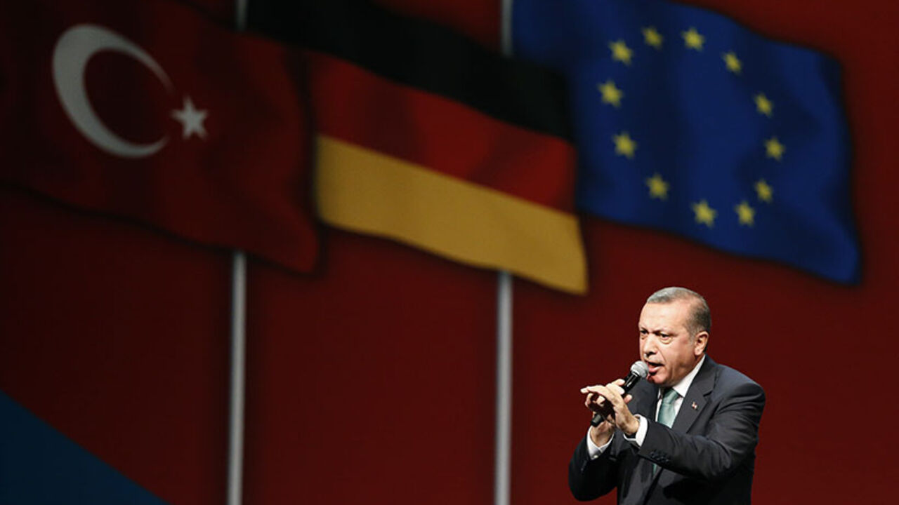 Turkish Prime Minister Erdogan speaks to supporters during his visit in Cologne Turkish Prime Minister Tayyip Erdogan speaks to supporters during his visit in Cologne May 24, 2014. REUTERS/Wolfgang Rattay (GERMANY - Tags: POLITICS) - RTR3QO46