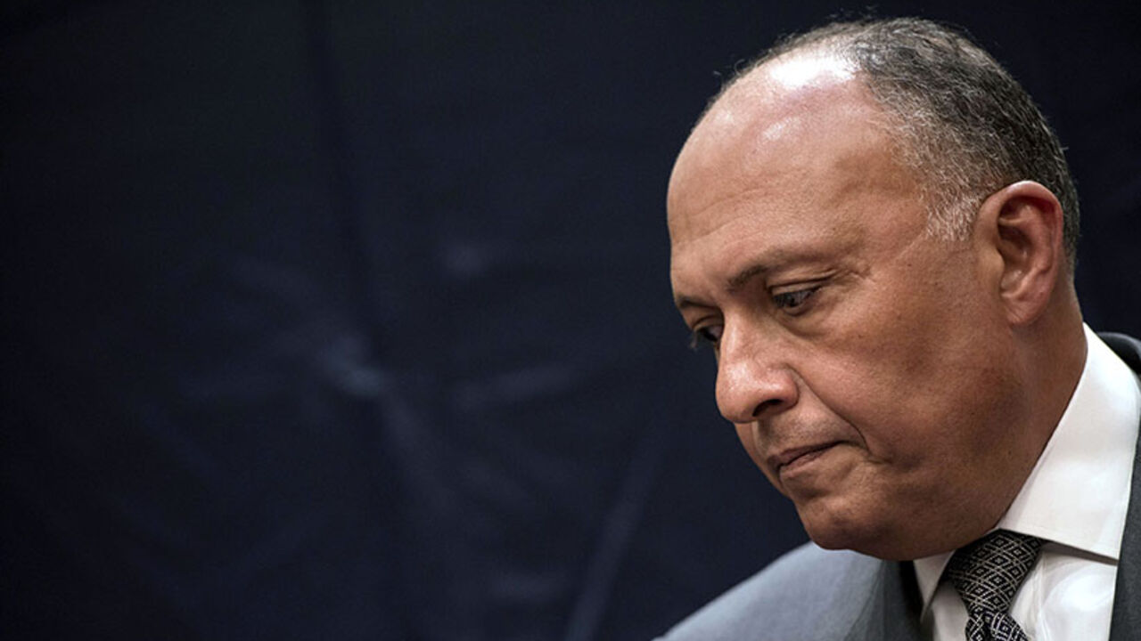 Egypt's Foreign Minister Shukri attends a joint news conference with U.S. Secretary of State Kerry in Cairo Egypt's Foreign Minister Sameh Shukri attends a joint news conference with U.S. Secretary of State John Kerry (not seen) in Cairo June 22, 2014. Kerry held talks on Sunday with President Abdel Fattah al-Sisi in Cairo over concerns about Egypt's crackdown on the Muslim Brotherhood and the threat which the conflict in Iraq poses to the Middle East. REUTERS/Brendan Smialowski/Pool (EGYPT - Tags: POLITICS) - RTR3V3Z9