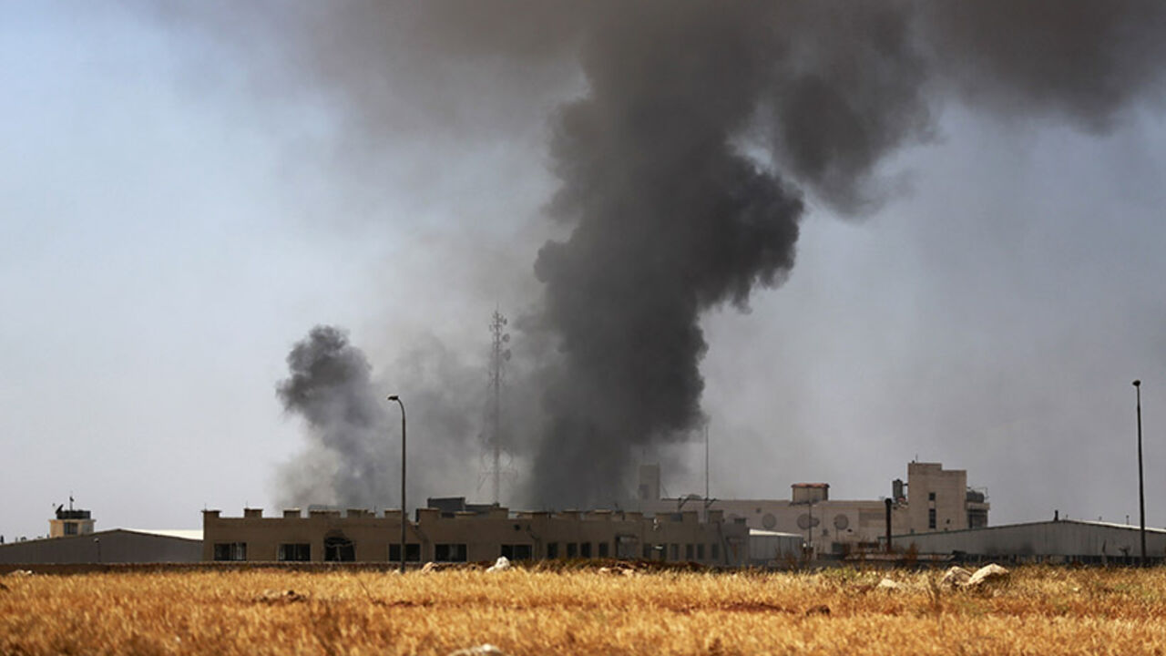 Smoke rises during what activists said were clashes between rebel fighters and forces loyal to Syria's President Assad in Aleppo Smoke rises during what activists said were clashes between rebel fighters and forces loyal to Syria's President Bashar al-Assad in Aleppo's Sheikh Najjar frontline June 30, 2014. REUTERS/Hamid Khatib (SYRIA - Tags: POLITICS CIVIL UNREST CONFLICT) - RTR3WHOA