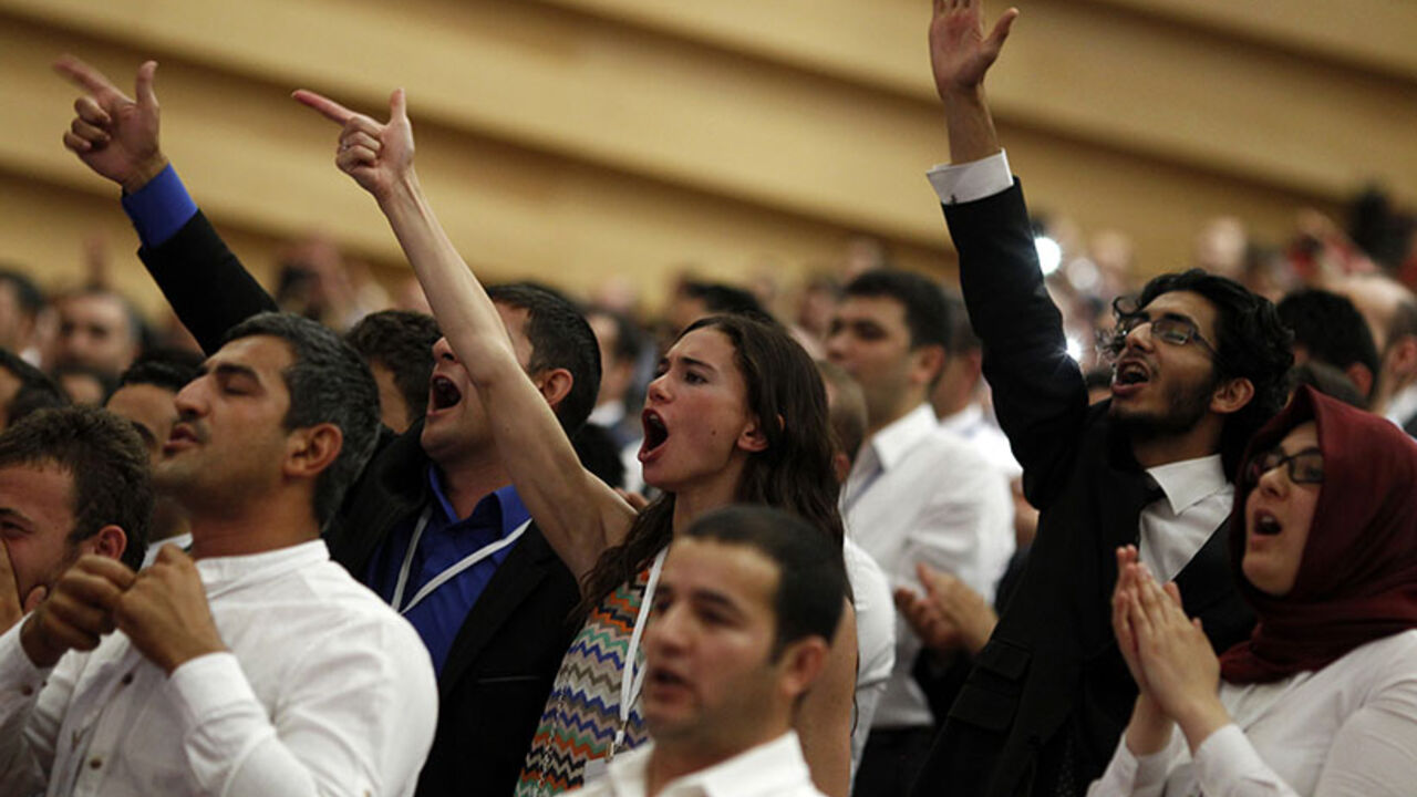 Supporters of Turkey's Prime Minister Tayyip Erdogan cheer as he declares his candidacy in Ankara Supporters of Turkey's Prime Minister Tayyip Erdogan cheer as he declares his candidacy in Ankara July 1, 2014. Erdogan declared his candidacy on Tuesday for a more powerful presidency which rivals fear may entrench authoritarian rule and supporters, especially conservative Muslims, see as the crowning prize in his drive to reshape NATO member Turkey. REUTERS/Umit Bektas (TURKEY - Tags: POLITICS ELECTIONS) - RTR3WLVO
